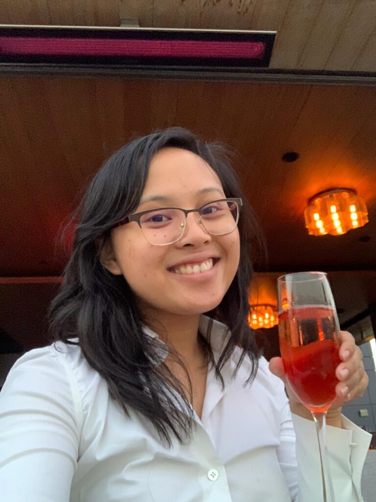 Shelby's bar restaurant selfie: Eatin' SF member Alyssa is wearing a white button down taking a picture with the whispering angel rose. 