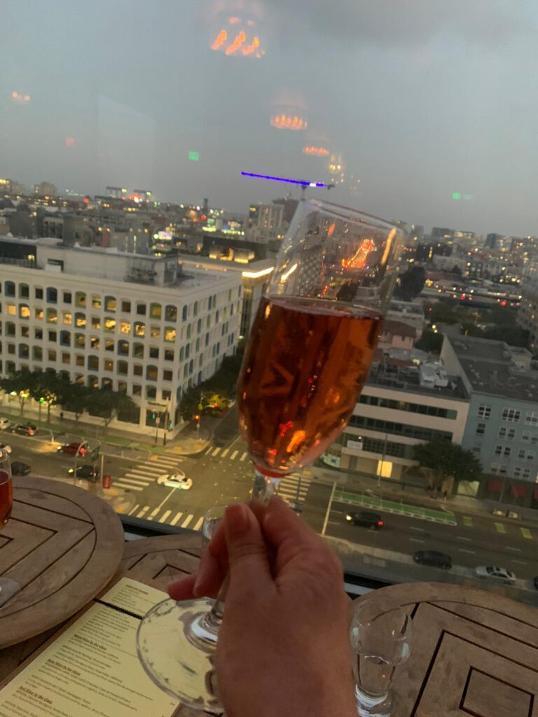 The bar restaurant's whisperring angel rose wine held against the view of Yerba Buena